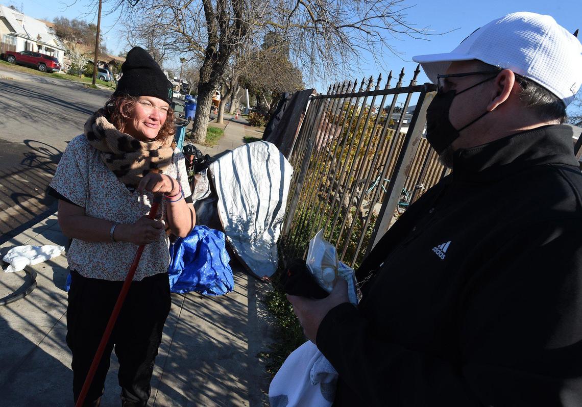 Sophia Manzo, a Fresno native, now homeless, talks with Shawn Jenkins, volunteer for the Point in Time count survey put on by the Fresno Madera Continuum of Care, in the Tower District, Feb. 25, 2022.