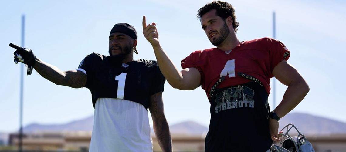 Las Vegas Raiders’ DeSean Jackson and Derek Carr go over practice on Wednesday, Nov. 10, 2021.