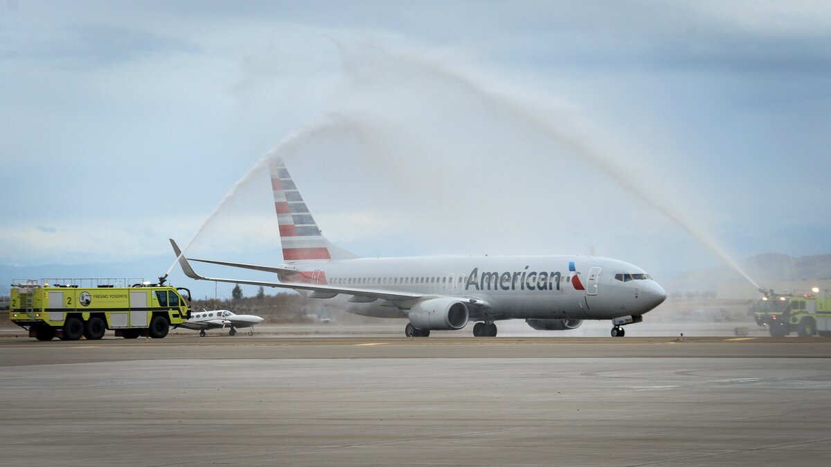 A jet taxis below a water canon salute by pair of Fresno-Yosemite International Airport’s aircraft rescue firefighting trucks at the airport on Wednesday, Dec. 5, 2018. The jet was carrying the remains of U.S. Marine Alva Jackson “Jack” Cremean, who was killed while aboard the USS Oklahoma during the Pearl Harbor attack of Dec. 7, 1941. His remains were identified nearly 77 years after his death via DNA. He will be laid to rest on Friday, Dec. 7, 2018 at Madera’s Arbor Vitae Cemetery with full military honors.