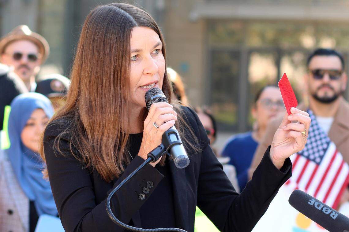Allison Davenport from Immigrant Legal Resource Center (ILRC) talks about how the red cards are an important resource around Know Your Rights and the constitutional rights of everyone, regardless of immigration status in downtown Fresno on Nov. 8, 2024,