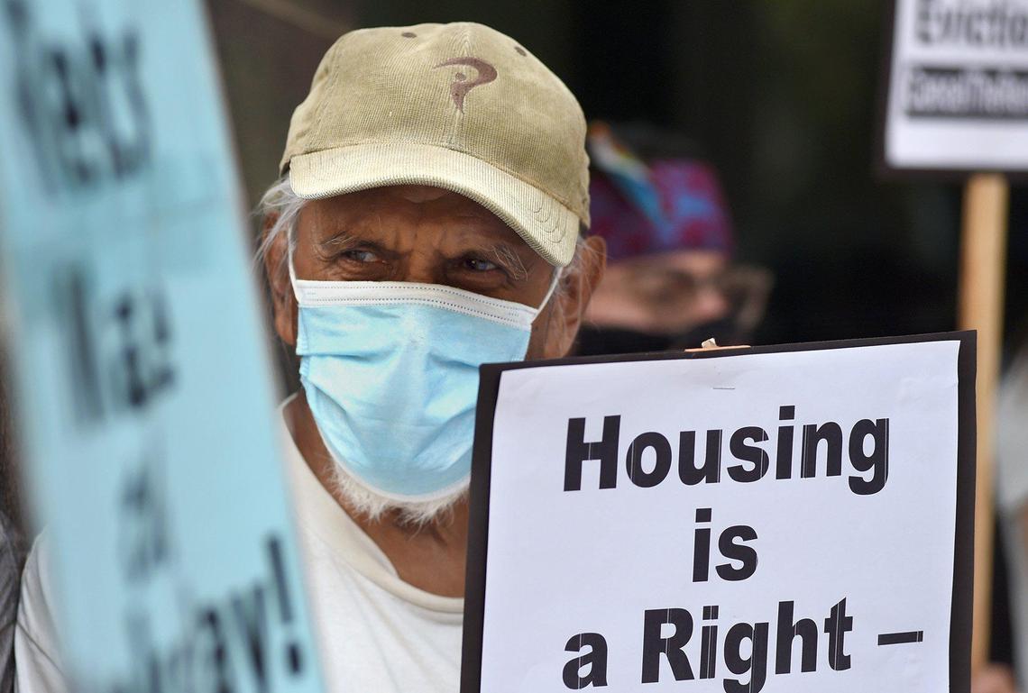 76-year-old Eduardo Castro of Fresno joins with housing activists during the Stop All Evictions! protest Saturday Sept. 25, 2021, in front of Rep. Jim Costa’s office.