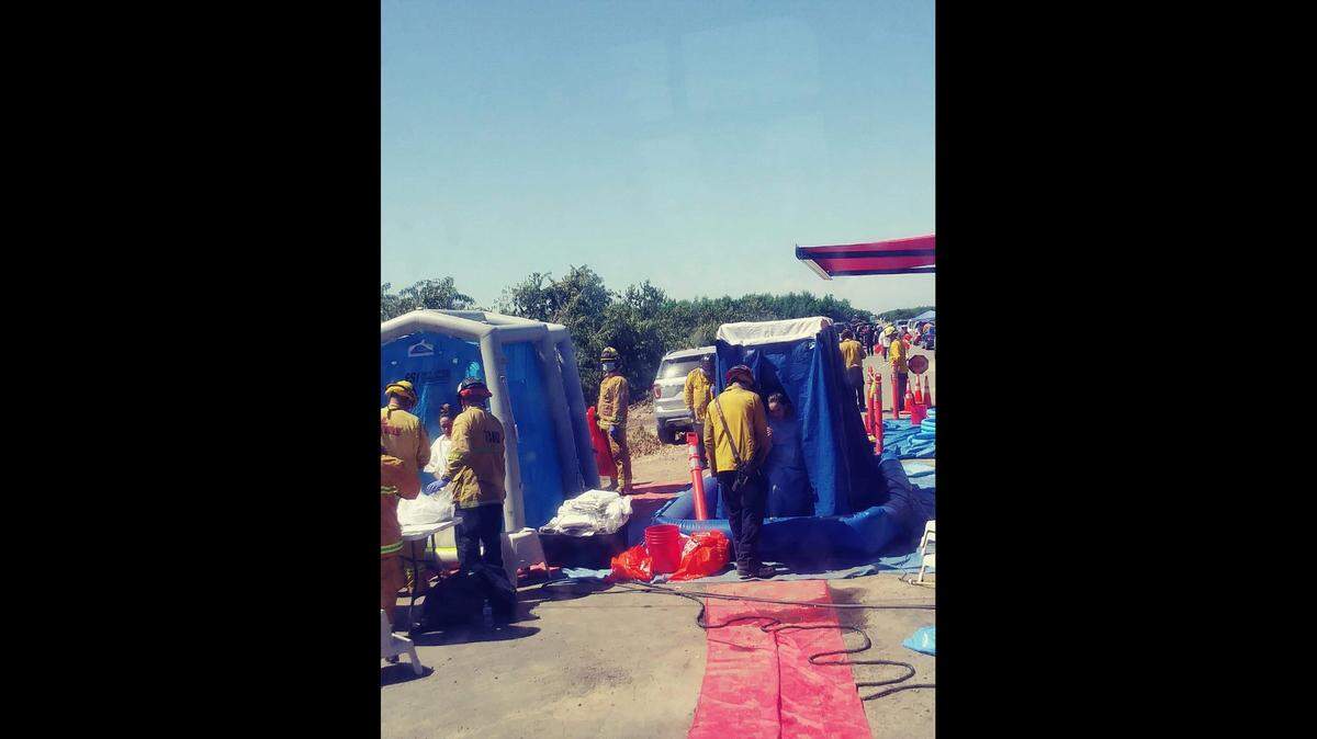 The scene of a decontamination process following a pesticide exposure at a vineyard in Tulare County on June 18, 2019.