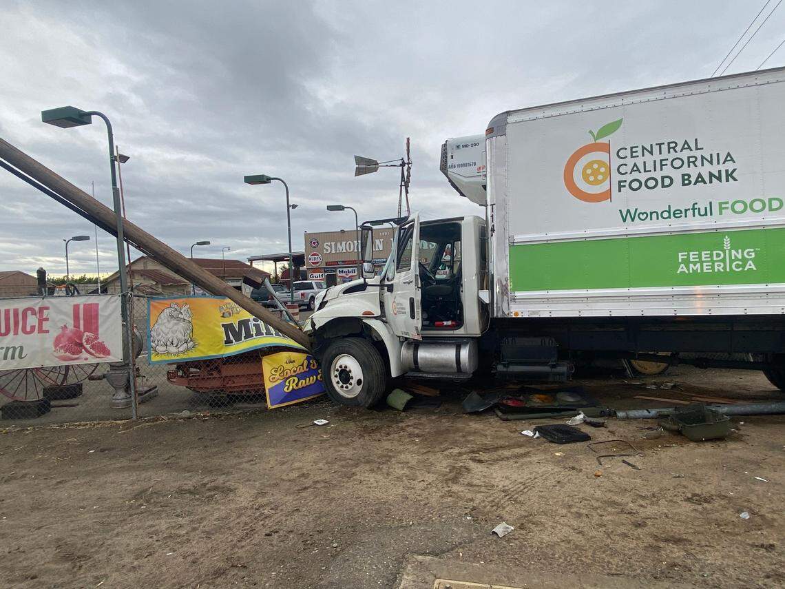 A commercial truck smashed through poles and a fence at the southeast edge of Fresno on Tuesday, California Highway Patrol said.
