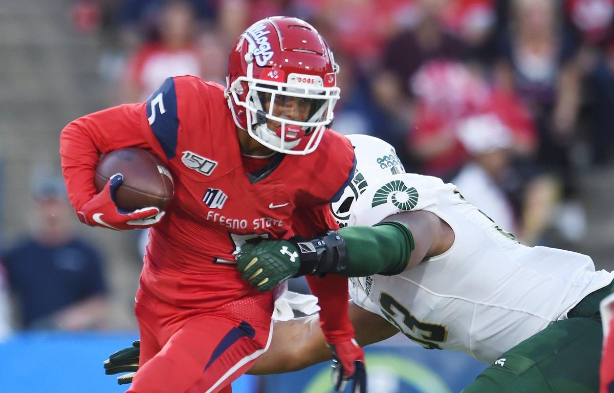 Fresno State’s Jalen Cropper, left, evades Colorado State’s Manny Jones, right, in the Bulldogs’ 41-31 loss Saturday, Oct. 26, 2019 in Fresno.