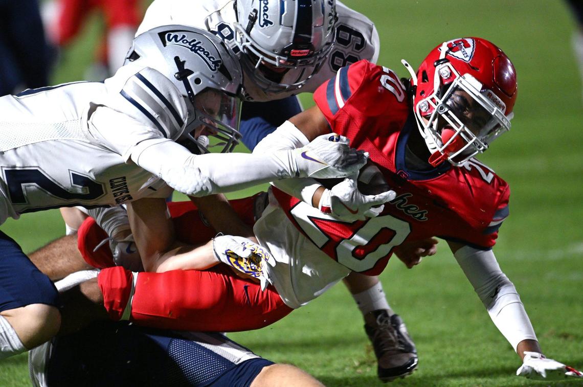 Sanger’s Ethan Leija, right, is brought down by the Clovis East defense Friday, Sept. 6, 2024 in Sanger. Final score, Clovis East 56, Sanger, 3.