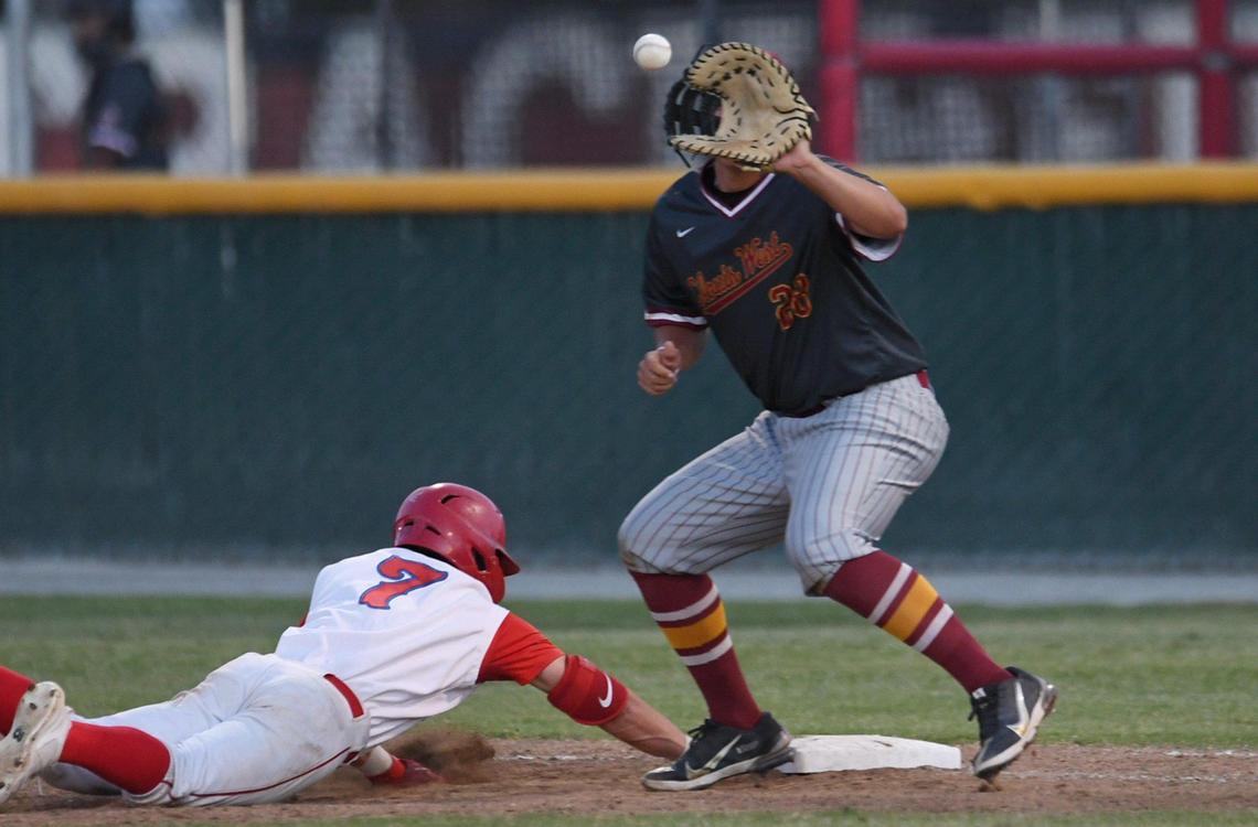 Buchanan’s Jett Ruby, left, beats the throw back to first covered by Clovis West’s Christian Badger in the third game of a three-game series Friday, May 6, 2022 in Clovis.