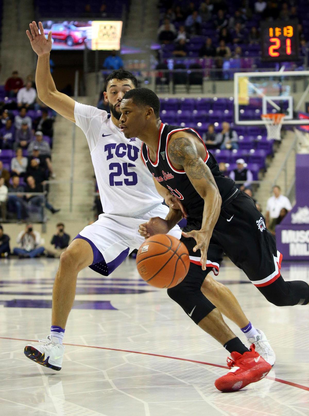 TCU guard Alex Robinson (25) defends against the drive by Fresno State guard New Williams (0) in the second half of the Bulldogs’ 77-69 loss to the Horned Frogs Thursday, Nov. 15, 2018, in Fort Worth, Texas. Williams came off the bench to hit 6 of 10 shots including 5 of 7 at the 3-point line in scoring 17 points.