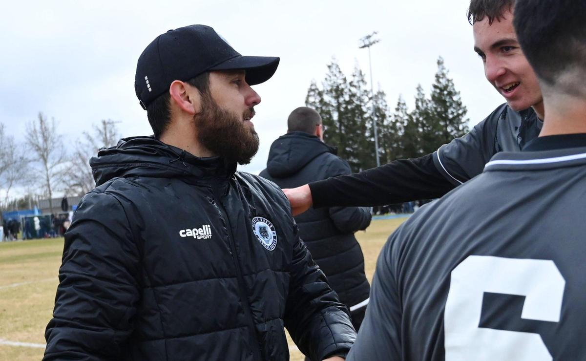Clovis North head coach Cameron Shahrokhi, left, celebrates the team’s 3-1 win against Ridgeview in the Central Section Boys Division I soccer championship Saturday, Feb. 25, 2023 in Clovis.