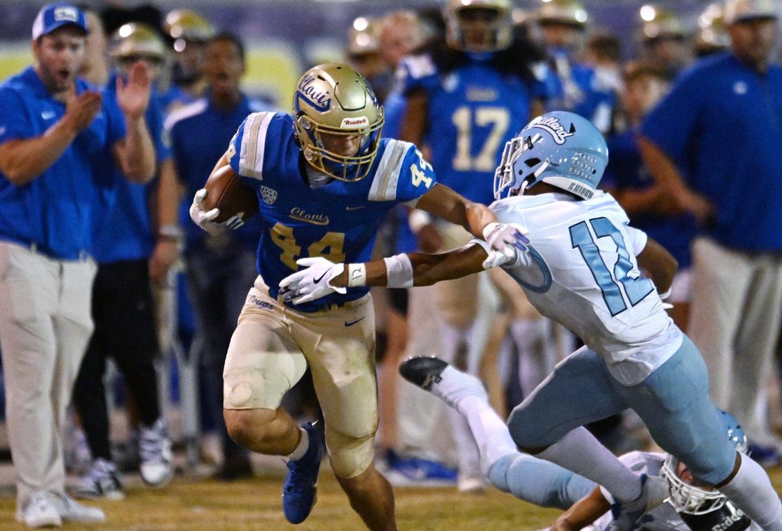 Clovis High’s Bryce McCave, left, is tackled by Bullard’s Jayden Jenkins, right, Friday night, Sept. 20, 2024 at Lamonica Stadium in Clovis.