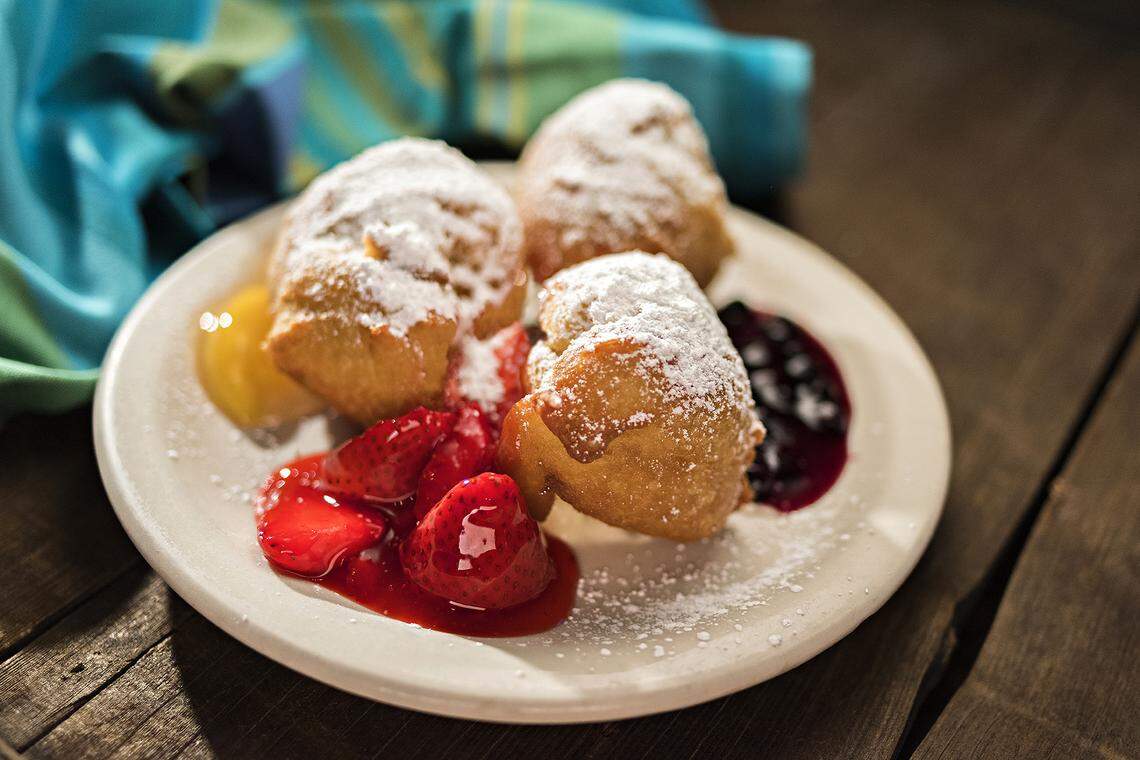 Mardi Gras beignets – fried pastry dough with fruit topping and vanilla cream filling – are the most popular menu item at Huckleberry’s restaurant. The breakfast and lunch spot is opening another Fresno location.