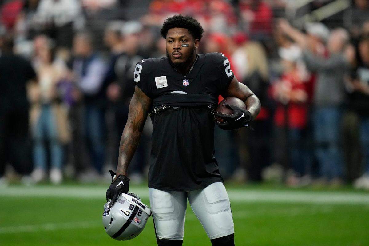 Las Vegas Raiders running back Josh Jacobs warms up before the start of an NFL game between the Las Vegas Raiders and Kansas City Chiefs Saturday, Jan. 7, 2023, in Las Vegas.
