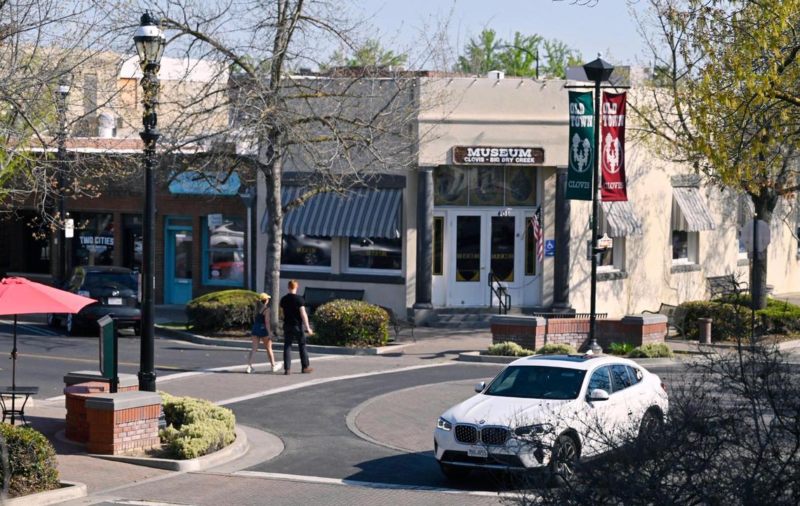 Pedestrians cross Fourth Street along Pollasky Ave. Wednesday, March 26, 2025 in Old Town Clovis.