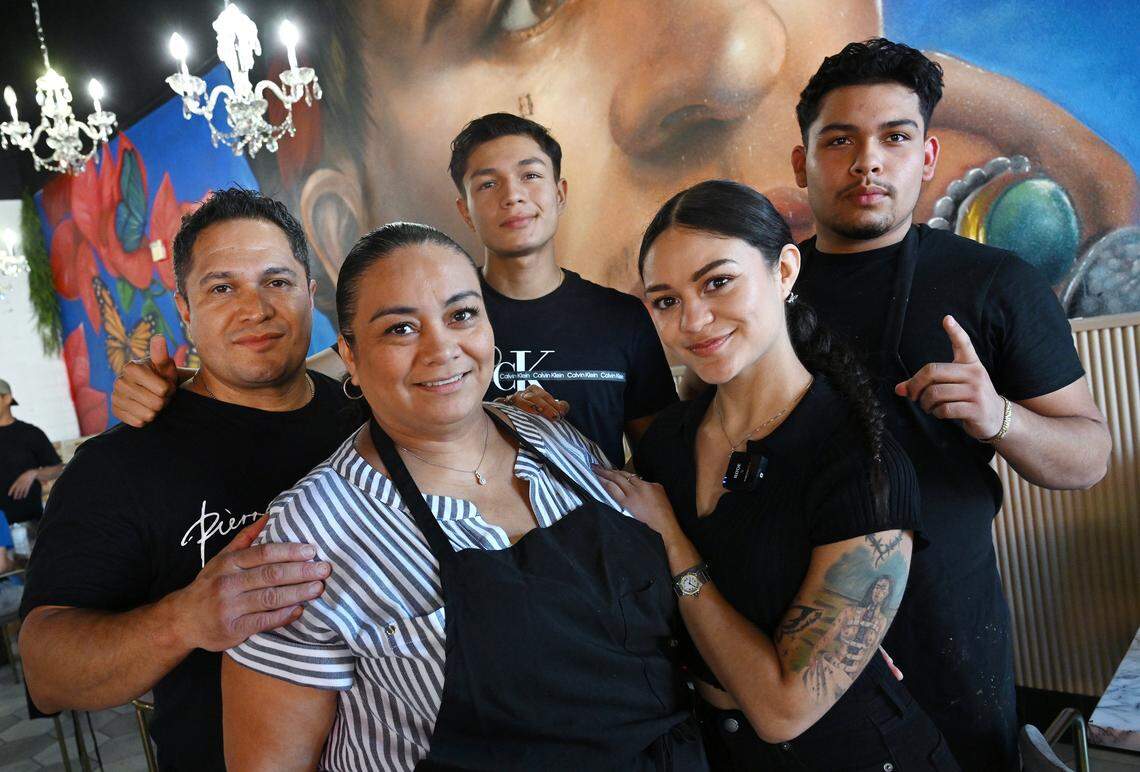 The Ayala family led by Robert, far left and Gracy Ayala, center, surrounded by their children at newly-opened Frida’s Azul located at Herndon and Willow avenues in Clovis Thursday, July 24, 2025.
