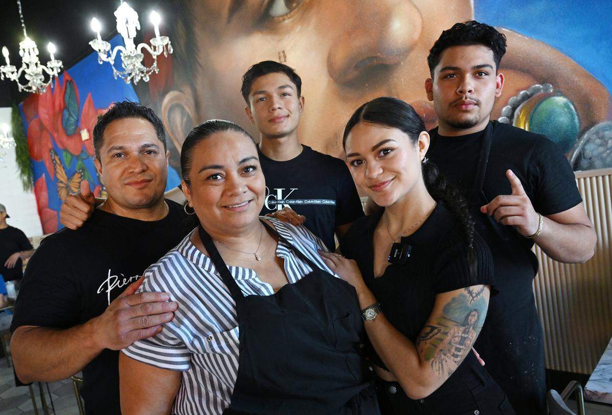 The Ayala family led by Robert, far left and Gracy Ayala, center, surrounded by their children at newly-opened Frida’s Azul located at Herndon and Willow avenues in Clovis Thursday, July 24, 2025.