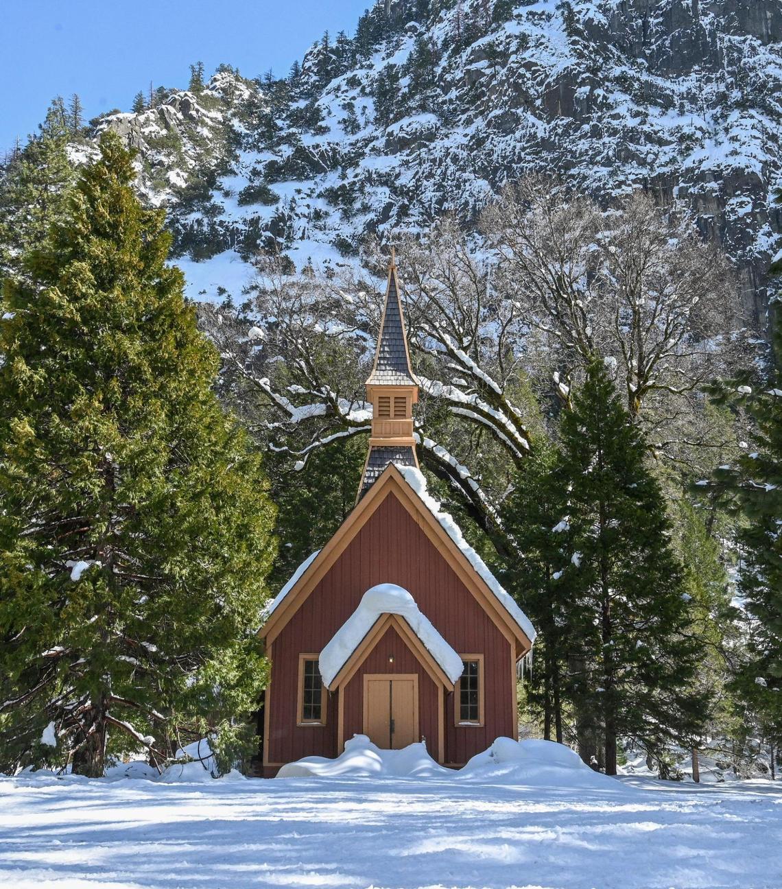 The Yosemite Vally chapel stands surrounded by a heavy blanket of snow on Friday, March 3, 2023
