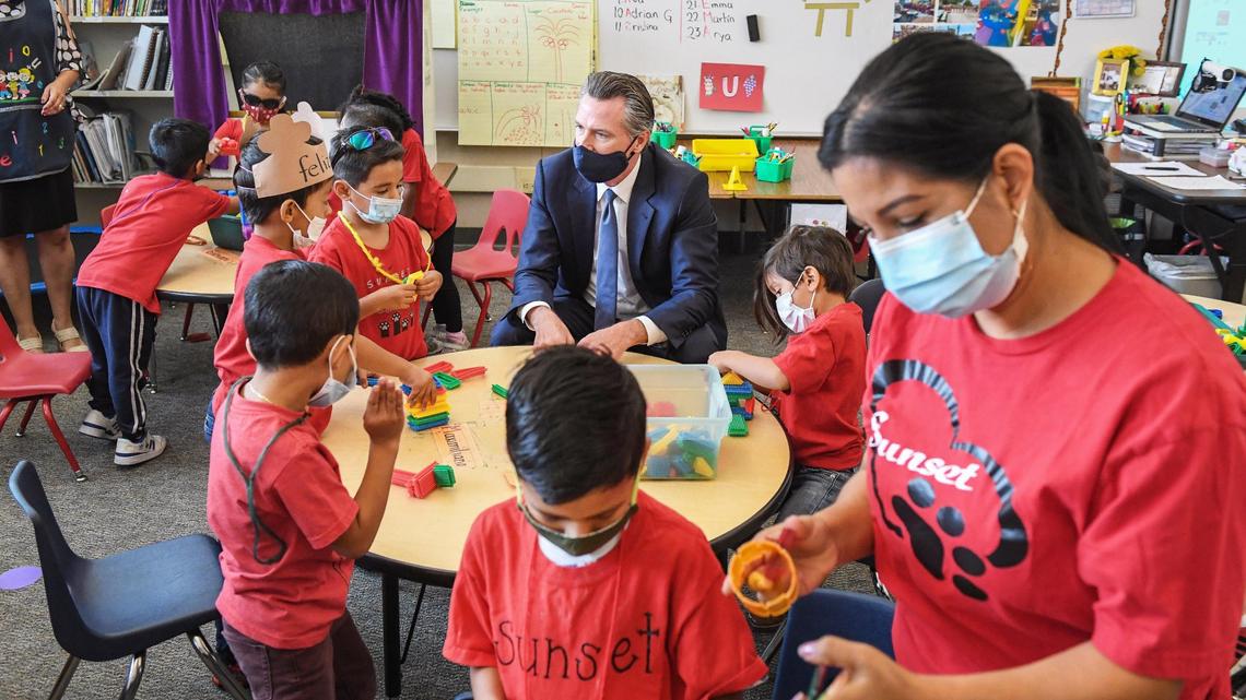 California Governor Gavin Newsom chats with kindergartners at Sunset Elementary School in Fresno during a visit to sign education legislation on Tuesday, Oct. 5, 2021.