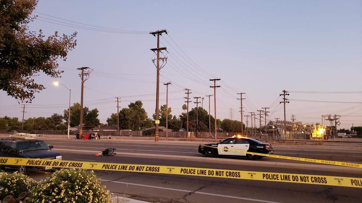 A wheelchair remains overturned on the westbound lane of McKinley Avenue on the evening of Friday, Sept. 20, 2019. Police say a woman was fatally struck by a car as she tried to cross the street in Fresno, CA.
