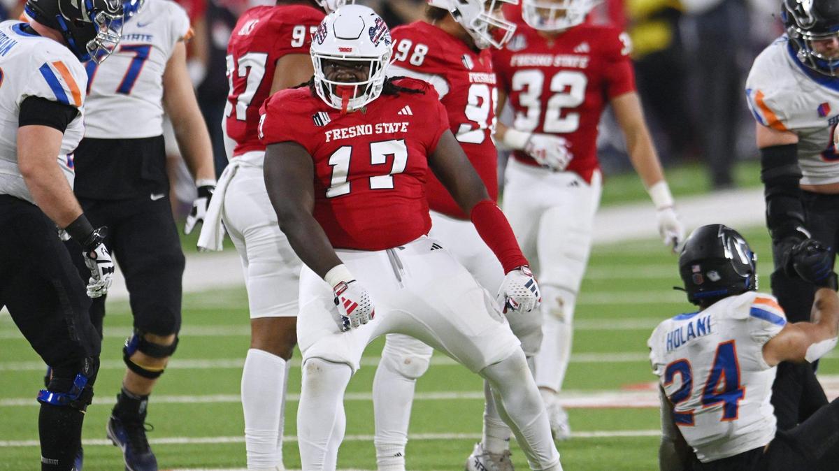 Fresno State defensive tackle Johnny Hudson Jr., center, dances after tackling Boise State running back George Holani in the Bulldogs 37-30 victory in the Battle of the Milk Can Saturday, Nov. 4, 2023 in Fresno.