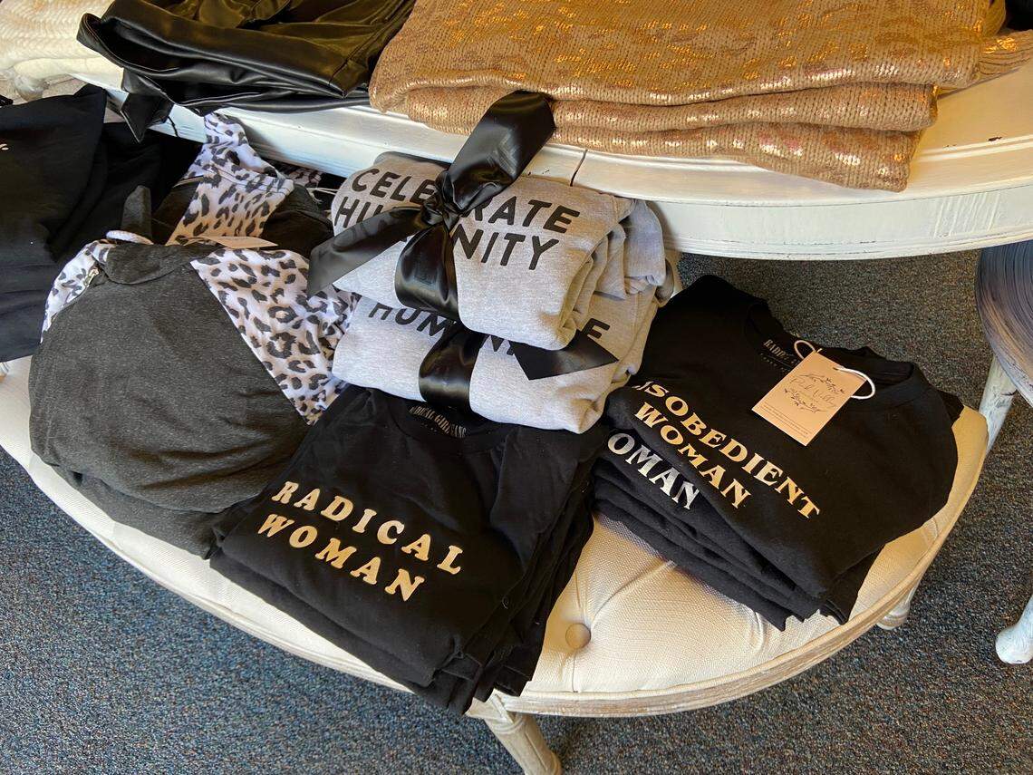 Shirts that say Celebrate Humanity, Disobedient Woman and Radical Woman at newly opened Pink Valley boutique benefit nonprofit organizations.