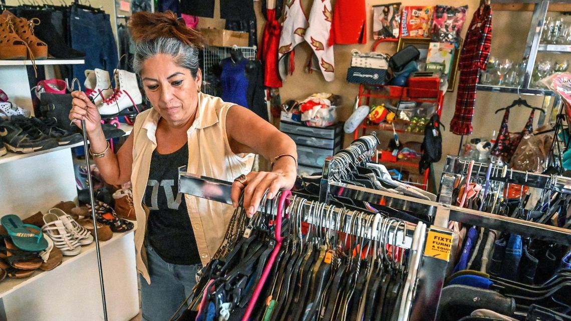 Nohemi Ramirez works in a thrift shop in Huron to make ends meet while the drought keeps her from finding work in the fields. Dry fields are limiting work opportunities for families and making an impact on local businesses in the southwestern town.
