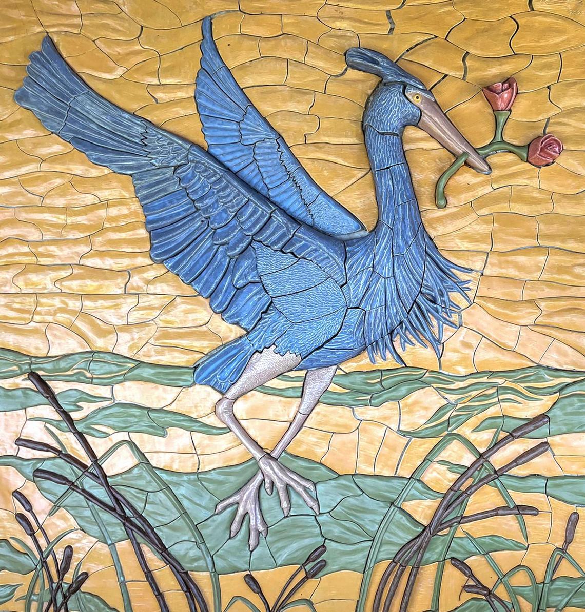 A photo shows the finished great blue heron ceramic mural that Fresno artist David Roberts and a class of University High School students created in 2022. At the moment the pieces of the mural are wrapped up in newspaper and stored in boxes in Roberts’ garage. He has been trying to find someone willing to invest in having the piece installed along the Lewis S. Eaton Trail in north Fresno to no avail.