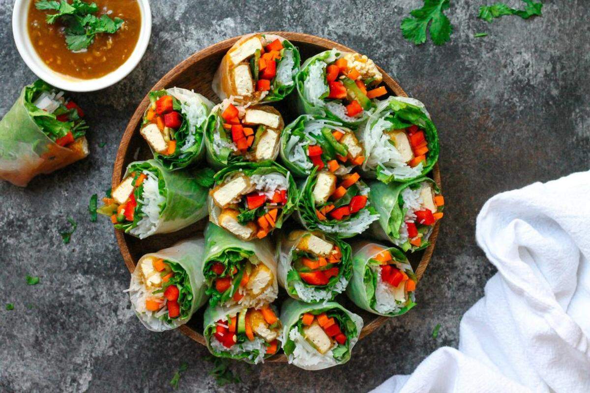The only cooking these pineapple glazed tofu summer rolls require is frying of the tofu on the stovetop for a summertime meal. 