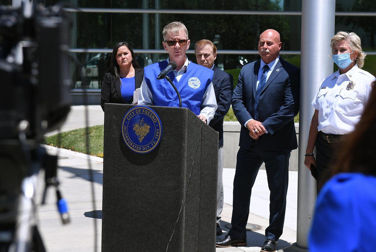 Kyle Krause, Deputy Director of Division of Codes and Standards for the State of California, center, addresses the media following the previous night’s fire at Trails End Mobile Home Park at a press conference Thursday, June 10, 2021 at City Hall in Fresno.