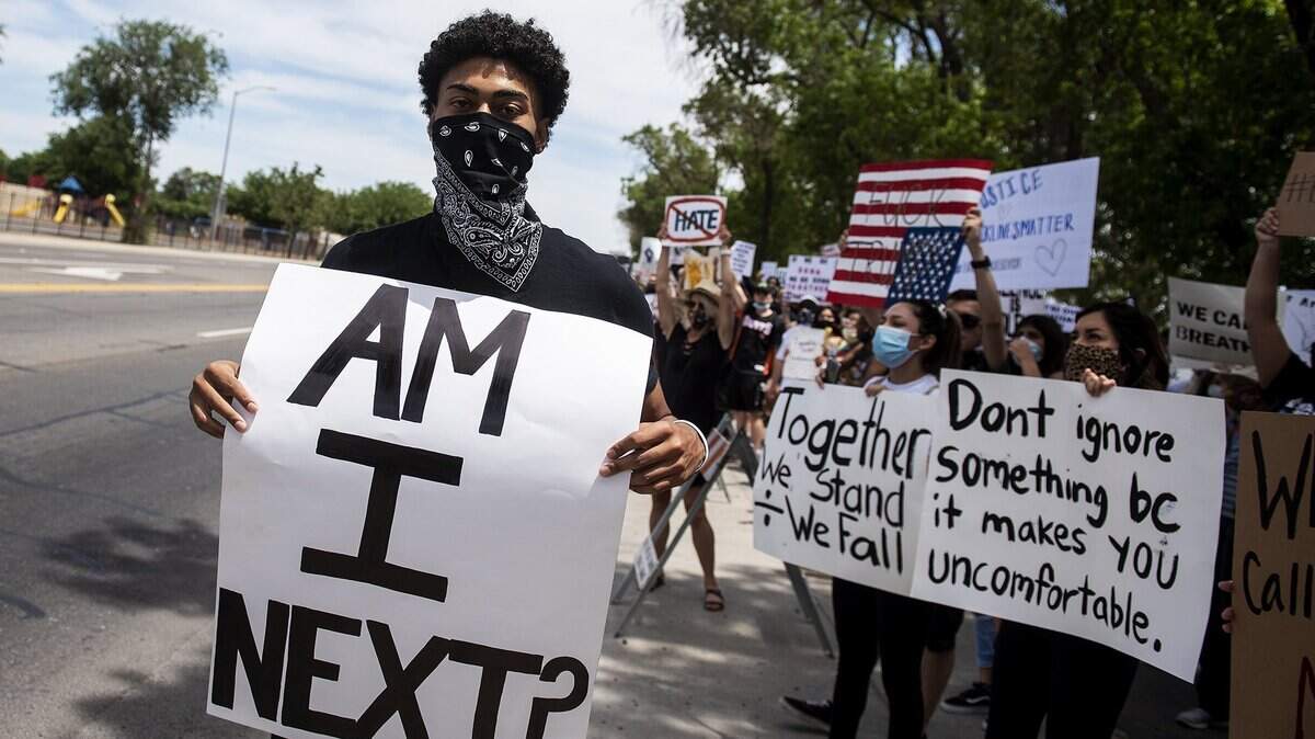 People protest the Minneapolis killing of George Floyd and police brutality in Los Banos, Calif., on Tuesday, June 2, 2020. Floyd, an unarmed black man, died after being pinned down by a Minneapolis police officer.