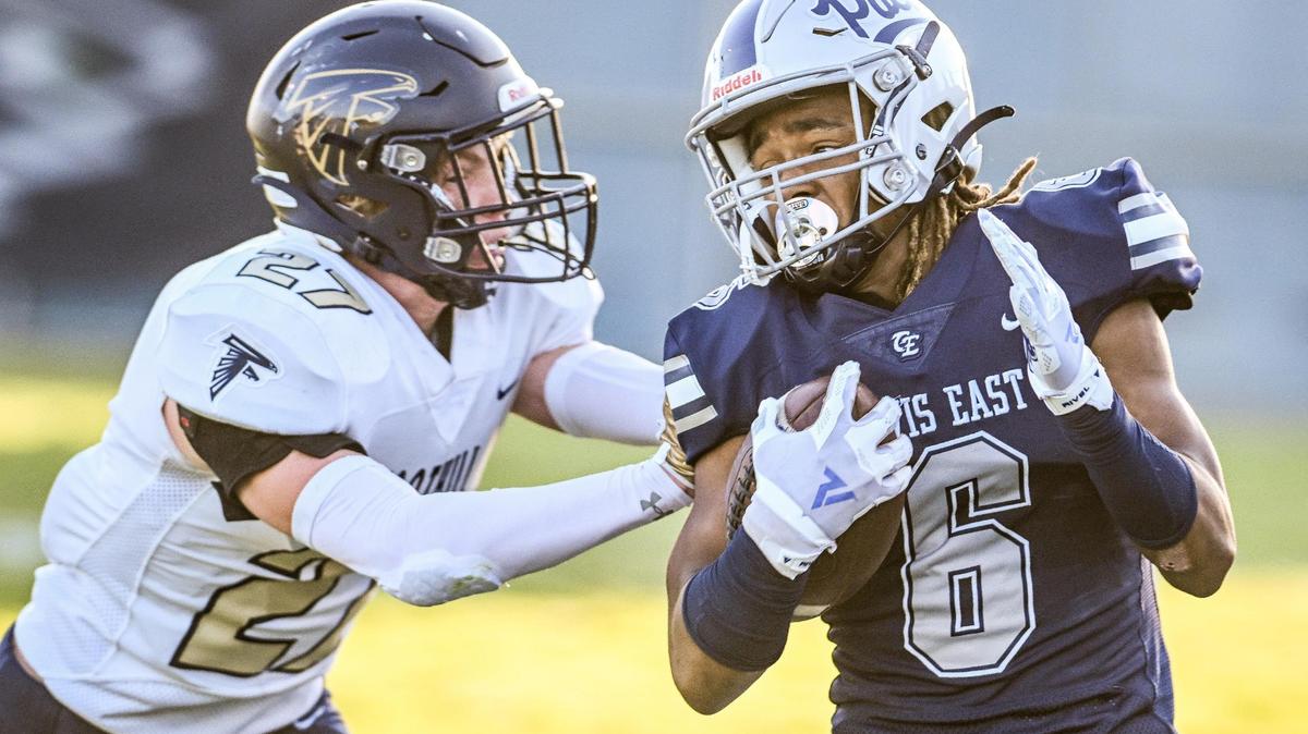 Clovis East’s Donyell Booker, right gets pushed out of bounds by Foothill’s Tyler Nelson after gaining yards up the sideline during their game at Lamonica Stadium on Friday, Aug. 18, 2023.
