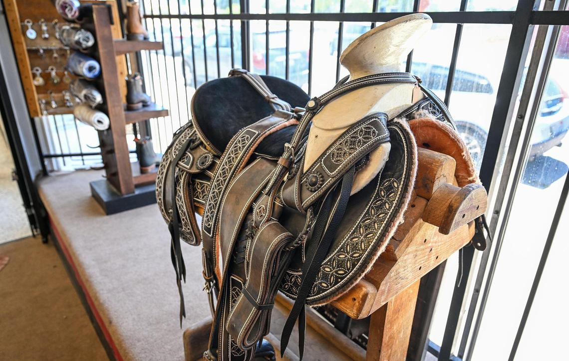 A specialized horse saddle is displayed in the front window at Rubio Ranchwear at its new shop on Fulton near Highway 180 just north of downtown Fresno.