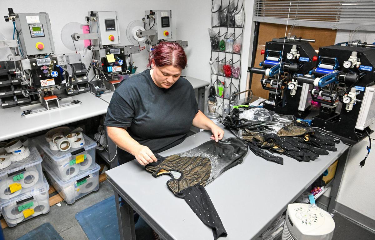Jennifer Dean does quality control checks on custom gymnastics leotards at Snowflake Designs in Clovis on Friday, July 26, 2024.