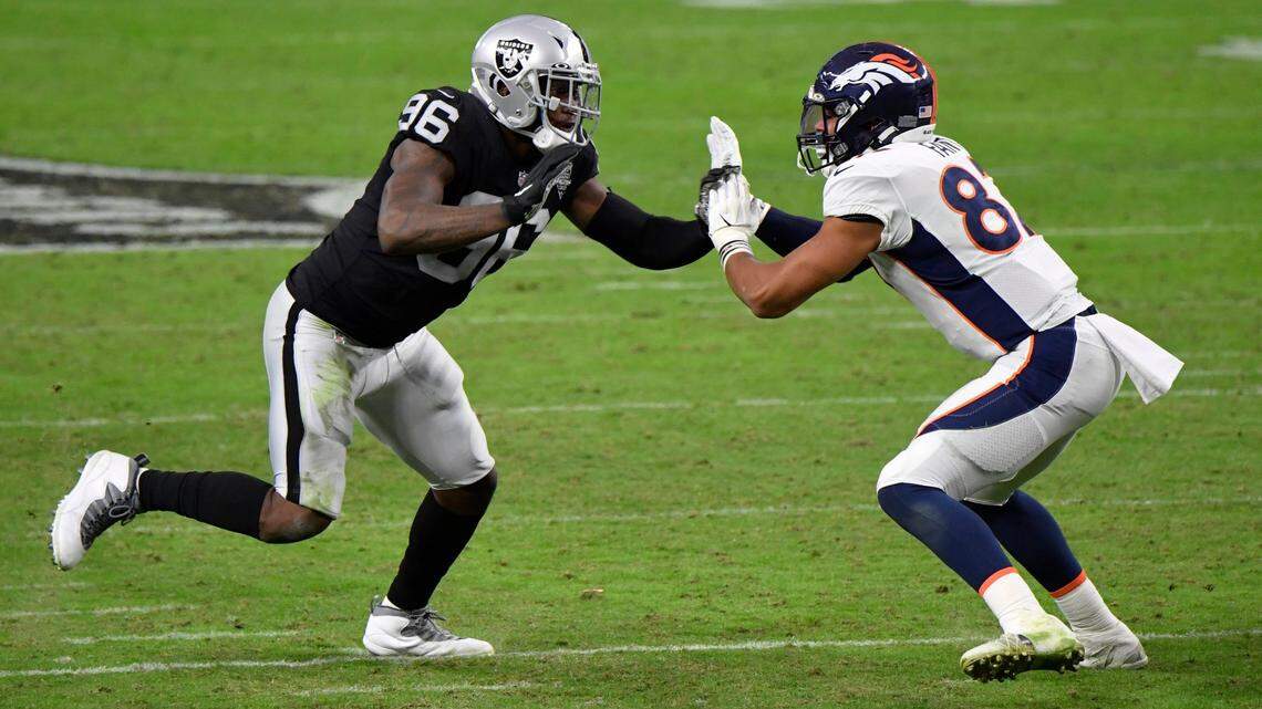 Las Vegas Raiders defensive end Clelin Ferrell #96 rushes against Denver Broncos tight end Noah Fant #87 during the second half during an NFL football game, Sunday, Nov. 15, 2020, in Las Vegas.