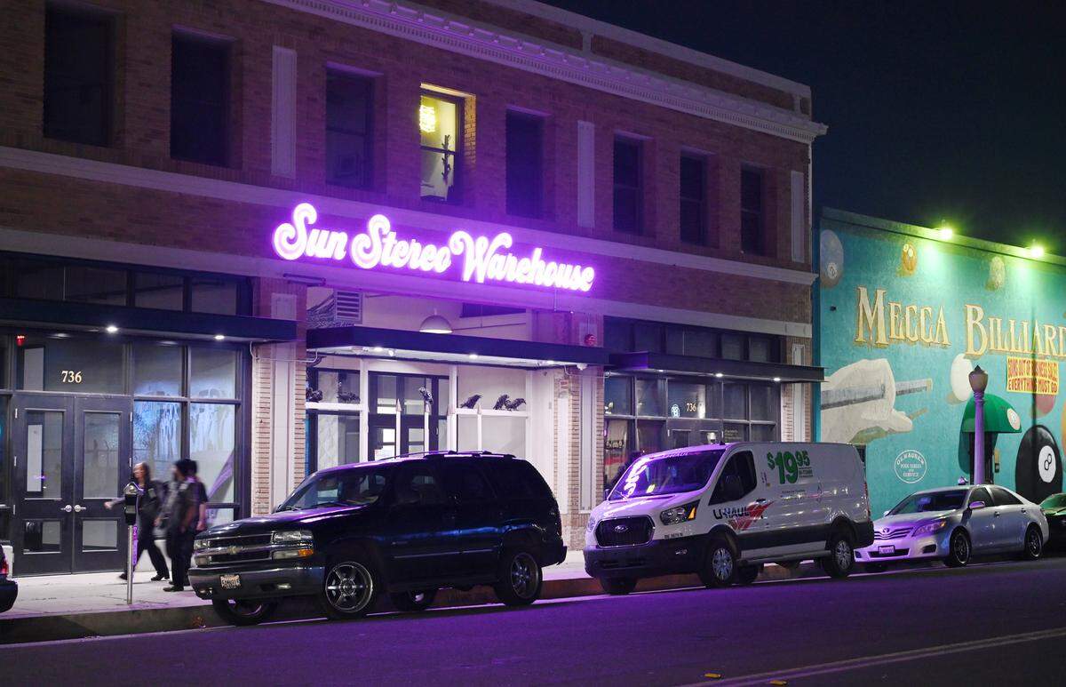 The new neon sign for Sun Stereo Warehouse is seen along Fulton Street in the Brewery District Thursday night, Feb. 9, 2023 in downtown Fresno.