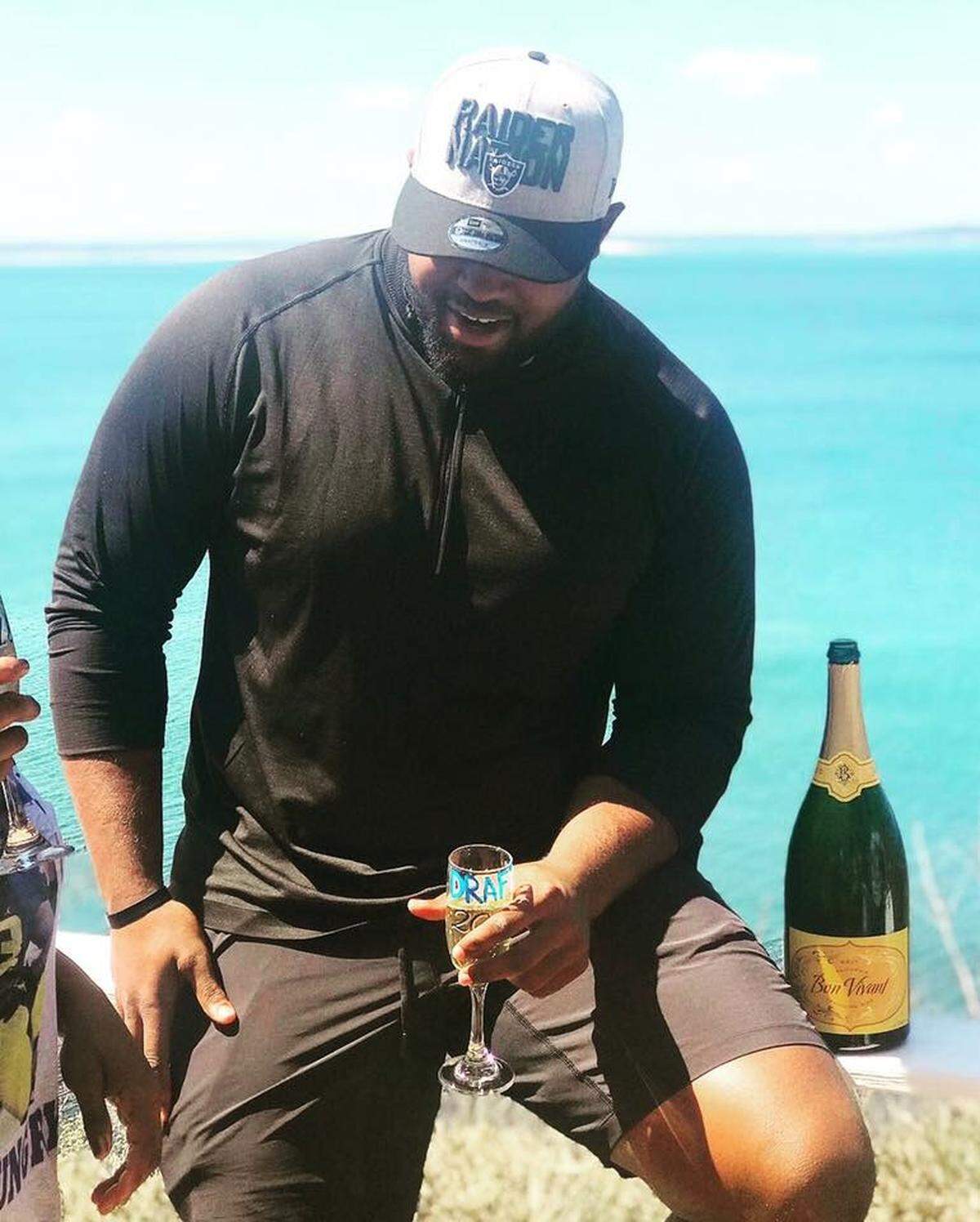 Maurice Hurst Jr. celebrates with family after the Oakland Raiders selected him in the fifth round of the 2018 NFL Draft.