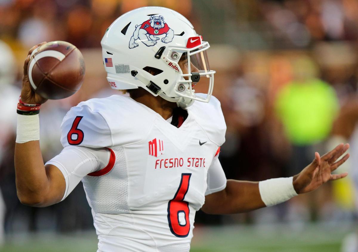 Fresno State quarterback Marcus McMaryion throws a pass against Minnesota in the first quarter of the Bulldogs; 21-14 loss to the Golden Gophers, Saturday, Sept. 8, 2018, in Minneapolis. McMaryion completed 23 of 32 passes for 205 yards with two touchdowns and one interception.