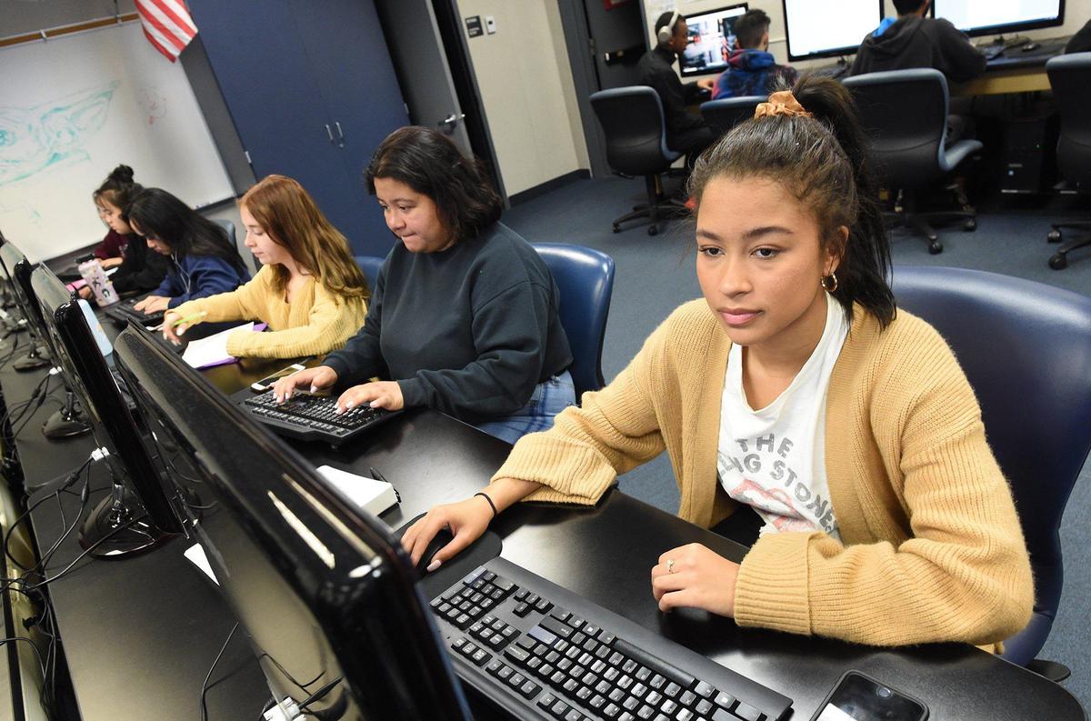 Clovis East junior Kayleigh Payne, right, works in the Multimedia Video Production lab at CART, Tuesday Jan. 28, 2020.