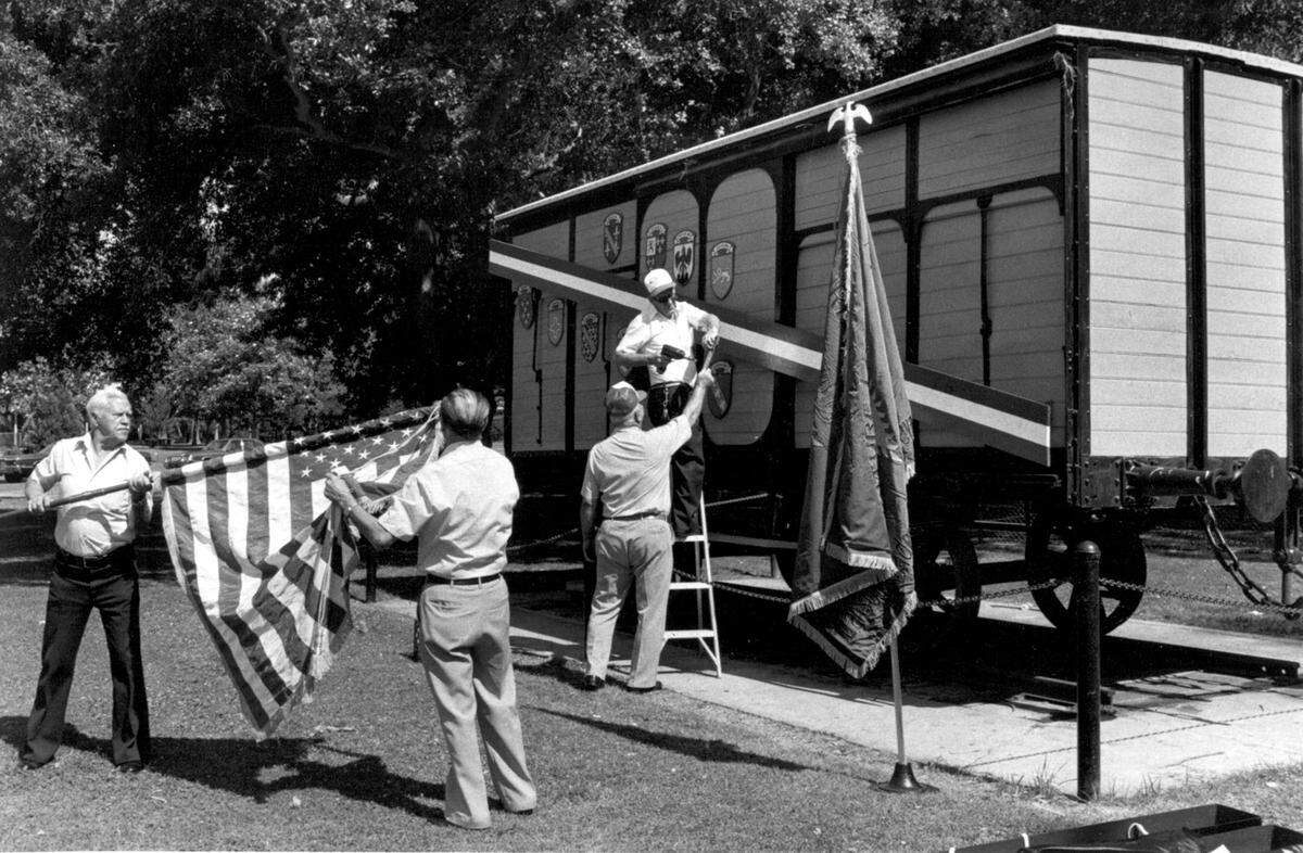In a 1985 file photo, members of the American Legion Post 509 in Fresno make preparations for the rededication of the renovated  Merci Boxcar in Roeding Park. Left to right are Joe Paulskas, H.O. Fleimister of Anaheim, Maurice Anderson and Chester Croswhite.