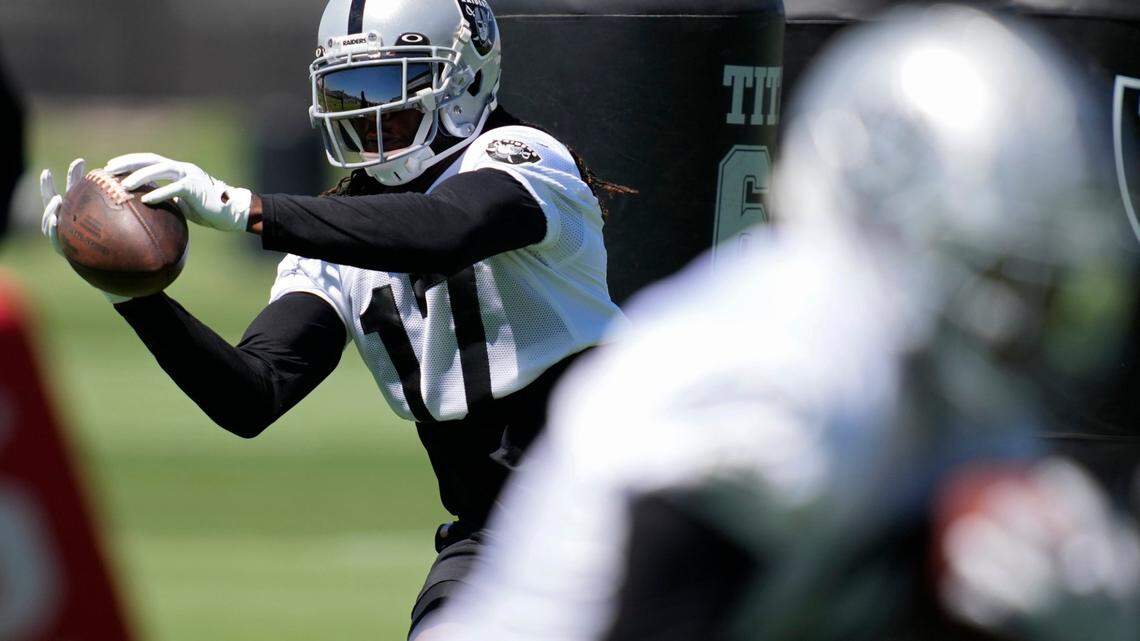 Las Vegas Raiders wide receiver Davante Adams catches a pass during practice at the practice facility Thursday, June 2, 2022, in Henderson, Nev.