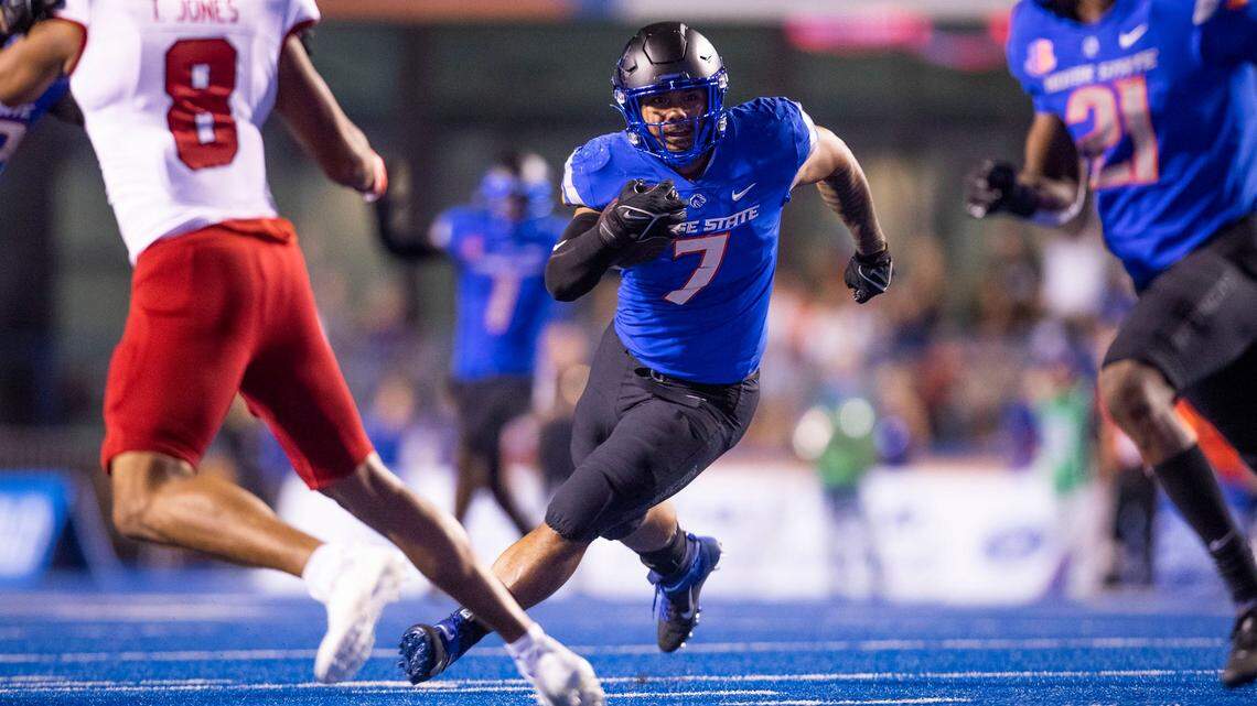 Boise State linebacker Ezekiel Noa runs the ball after intercepting a Fresno State pass, Saturday, Oct. 8, 2022, at Albertsons Stadium in Boise.