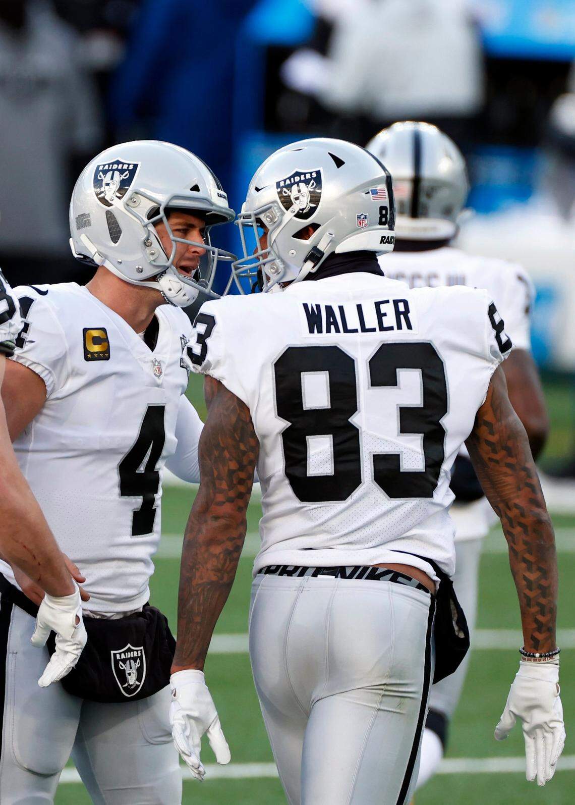 Las Vegas Raiders quarterback Derek Carr (4) celebrates with tight end Darren Waller (83) in action during an NFL football game against the New York Jets, Sunday, Dec. 6, 2020, in East Rutherford, N.J.