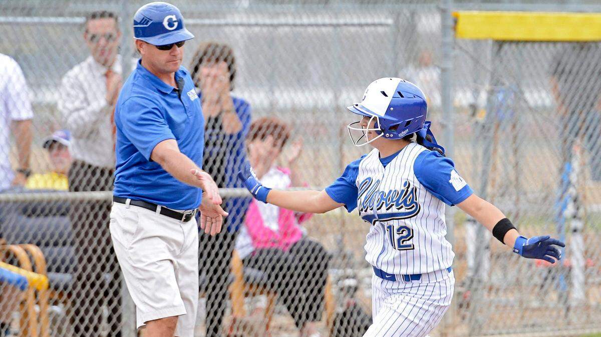 File photo. Clovis coach Mike Noel congratulates Alyssa Caballero after she hit a home run in the fourth inning against Central in the Central Section Division 1 softball championship at Clovis High Thursday, May 21, 2015.