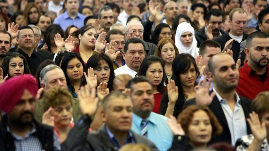 Scenes from the naturalization ceremony for 618 new U.S. citizens held at the Fresno Convention Center.