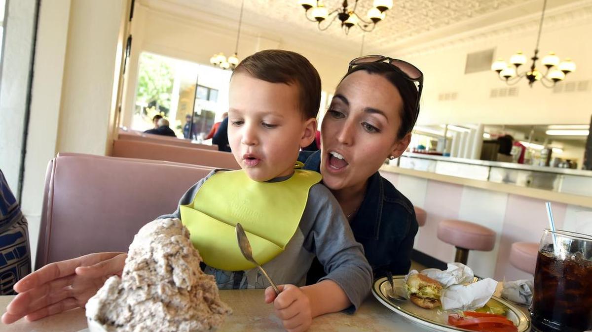 In a photo from 2016, Becky Woods and son Grant, 3, get ready to dig into a single serving of chocolate chip ice cream at possibly Hanford’s most well-known landmark, Superior Dairy, largely unchanged since it was built in 1929.
