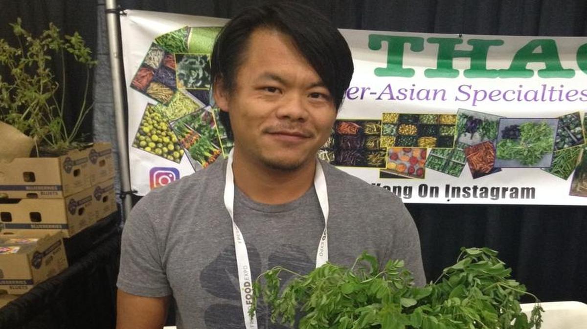 Fresno County farmer Kong Thao at the Fresno Food Expo. Thao sells much of his produce to restaurants in Los Angeles.
