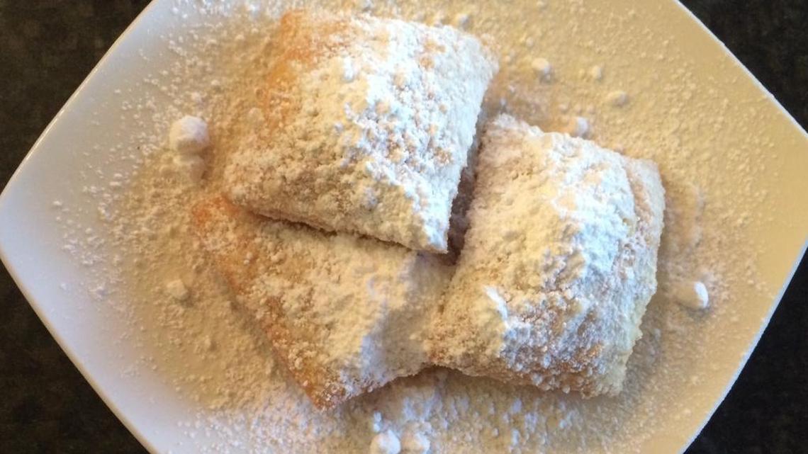 
The Old Hotel Bistro sells beignets – three for $2.49 – the little French squares of fried dough blanketed in powdered sugar, made in three minutes. The restaurant and shop at 356 Pollasky Ave. has a new chef and new items on the menu.
