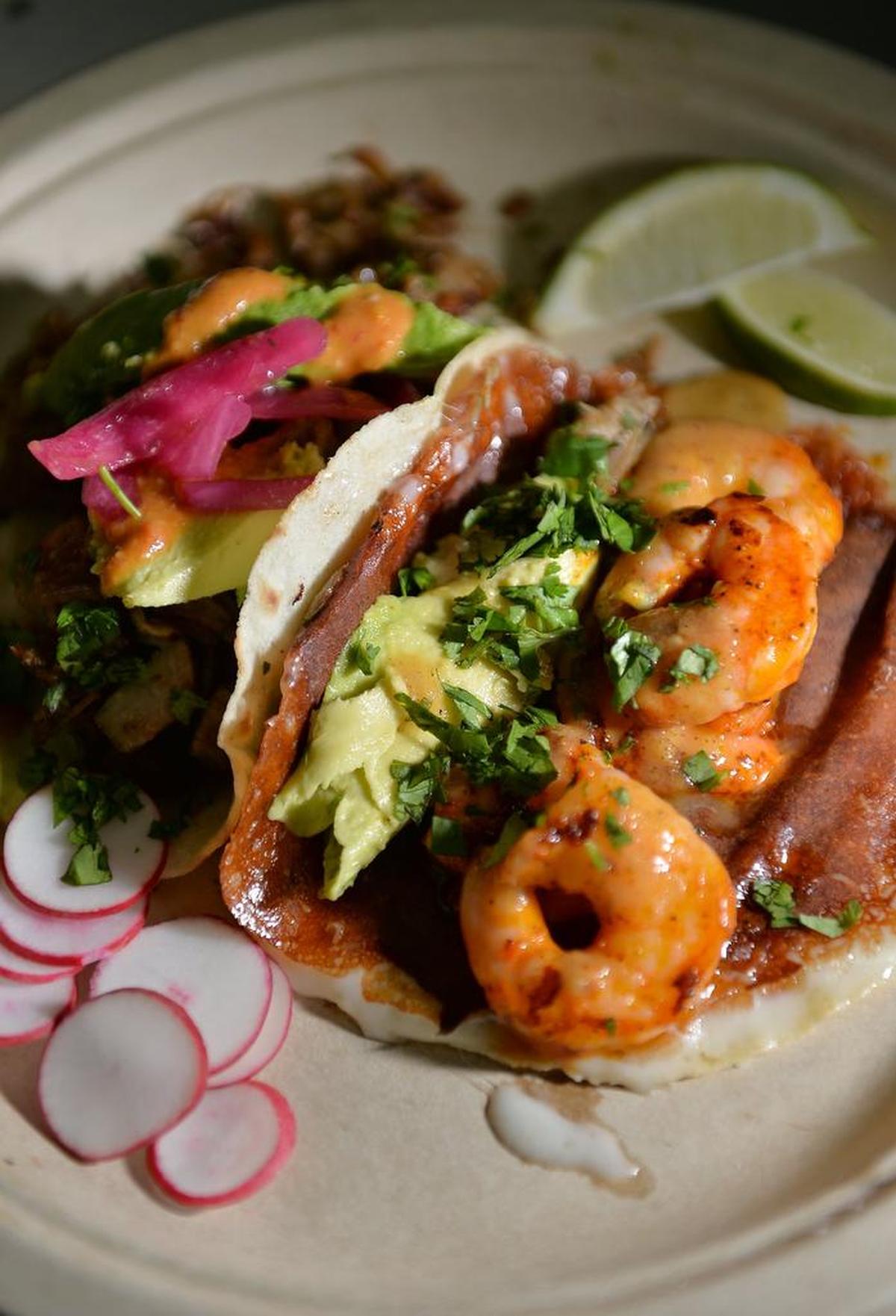 Having a tough time deciding shrimp or carnitas tacos? This taco combined shrimp and carnitas in one.