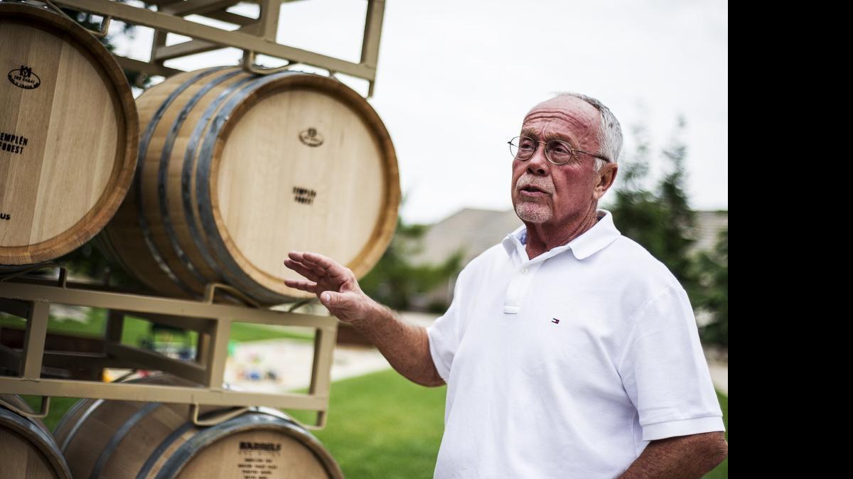 
Ken Andrus, 67, of Fresno, owner and distiller of In Distill of the Night Spirits, speaks about the oak-cask aging process of his Velvet Night Brandy in Atwater on Friday. Andrus, a former pharmacist, has been making brandy for the past five years.
