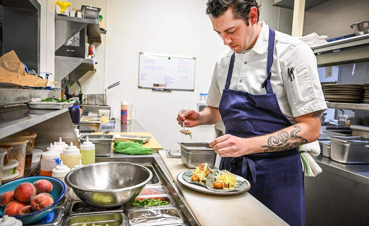 Chef Tyler Williams prepares a plate of beer-battered halibut tacos at Tabachines Cocina, located on the southwest corner of Herndon and Palm in Fresno, which has been voted in a poll by Fresno Bee readers as the highest-end restaurant in town.