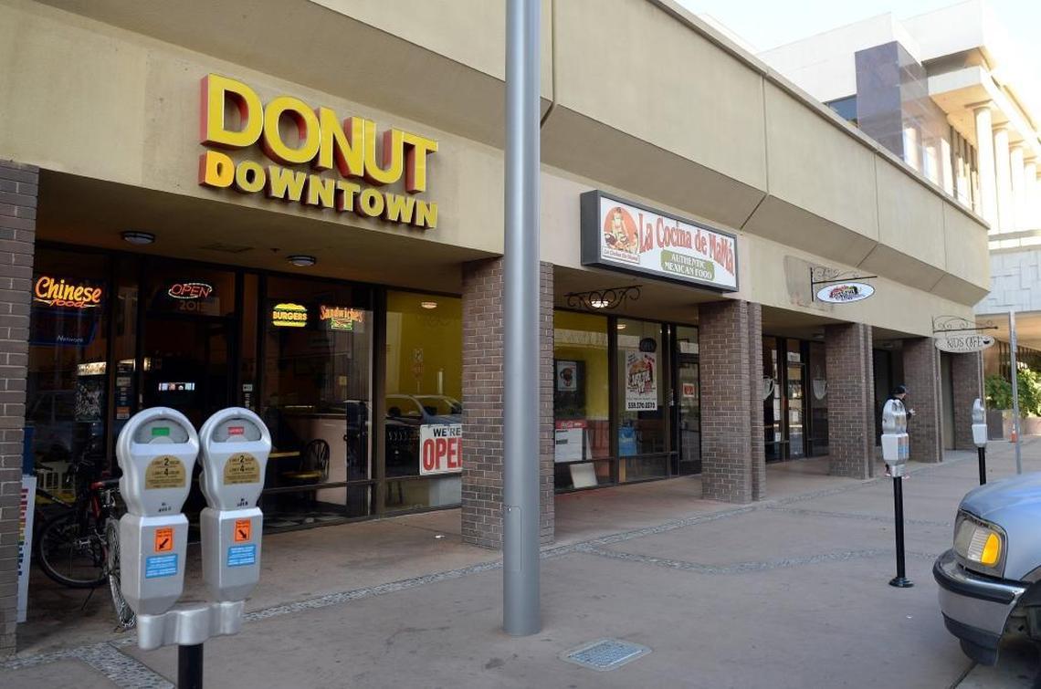 Existing restaurants, from left, Donut Downtown, La Cocina de Mamá, Just the Tip and Kids Cafe 2019, are located in what will be known as Renoir Corner, near the artist’s washer woman sculpture at the corner of Mariposa and Fulton streets in downtown Fresno.