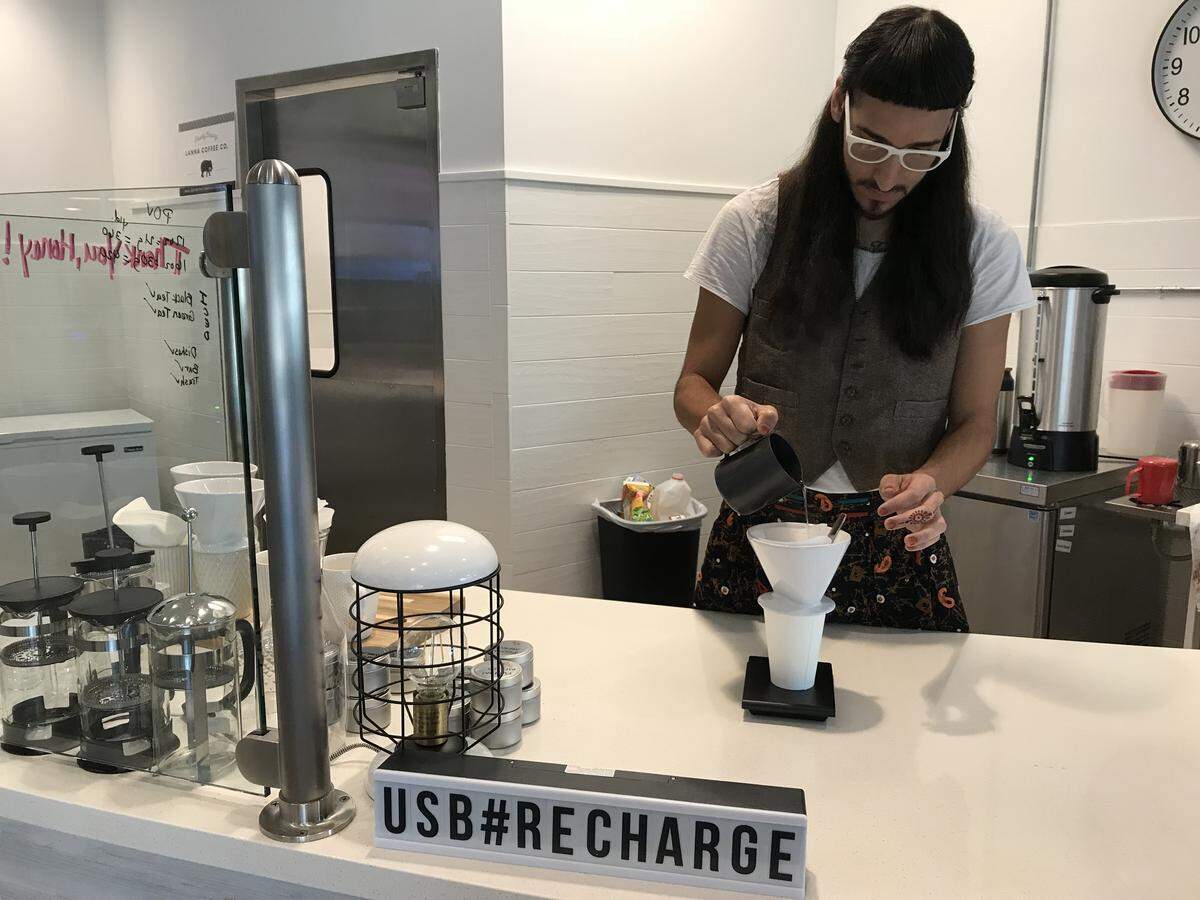 Israel-Elijah “Izzy” Lopez makes a pour-over coffee at USBean Brew Station inside Bitwise Stadium South.